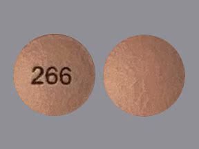 Hydromorphone 8 mg ER Tablets Canada Hydromorphone 8 mg ER tablet front and back view, reddish brown round extended-release opioid pain medication Canada